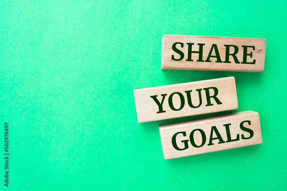 Wooden blocks with words 'Share your goals'. Wooden blocks with words 'Share your goals'.