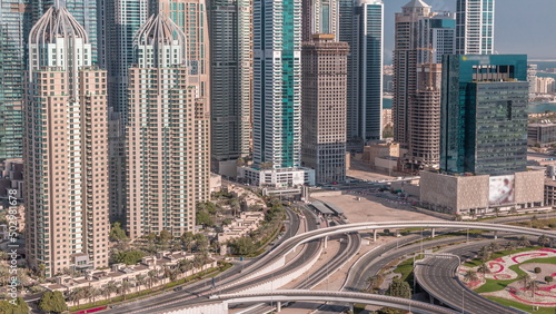 Skyscrapers of Dubai Marina near intersection on Sheikh Zayed Road with highest residential buildings timelapse