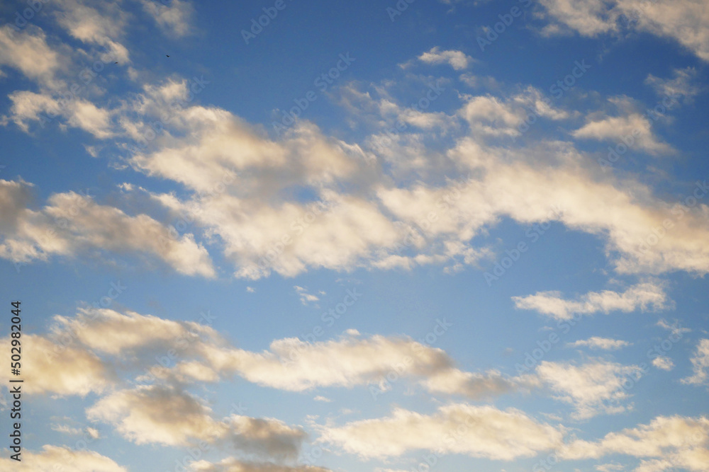 White, fluffy clouds in blue sky. Background from clouds. Beauty clear cloudy in sunshine.