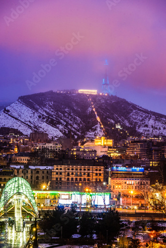 Snowing in Tbilisi city in the evening