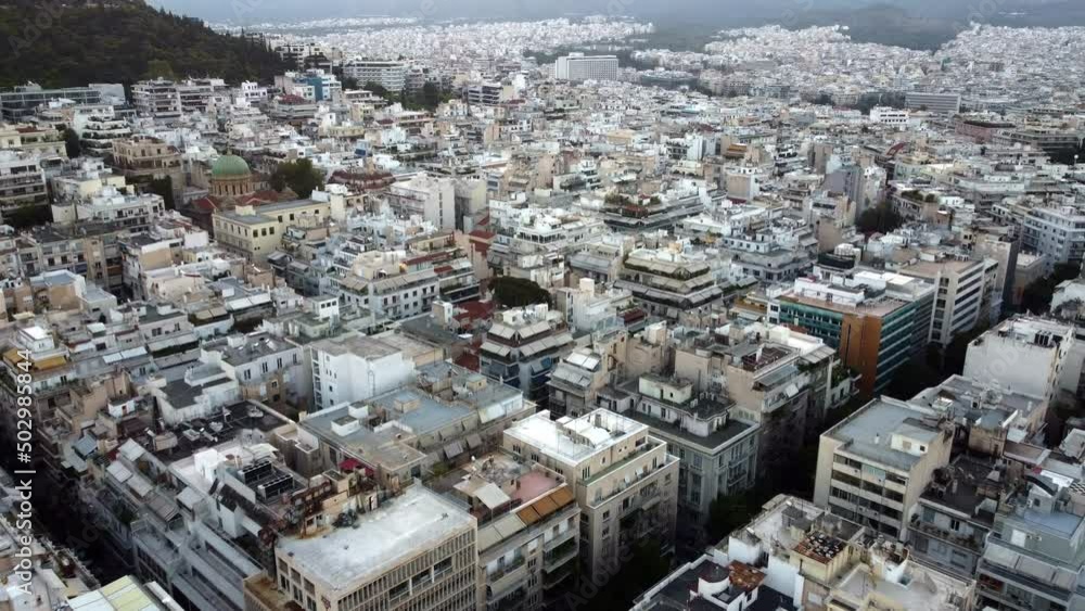 Drone view of the hilly areas of Athens at foot of the mountains before sunrise. Drone view of the hilly areas of Athens at foot of the mountains before sunrise.