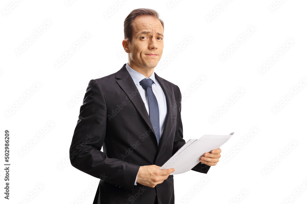 Disappointed businessman holding a document Disappointed businessman holding a document