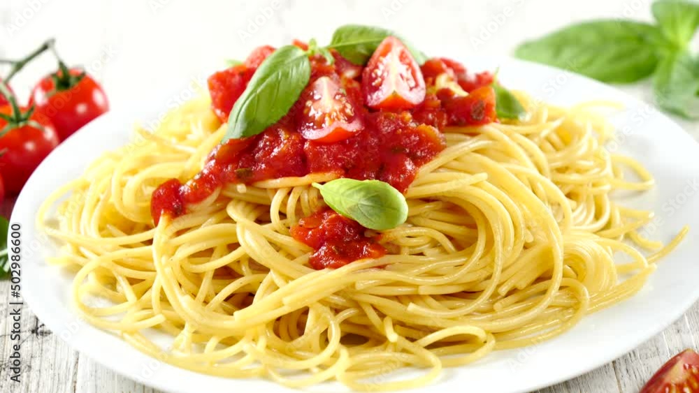 plate of spaghetti and tomato sauce plate of spaghetti and tomato sauce