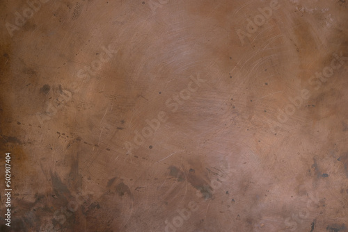 Grunge copper background with blurred effect. Copy space. 