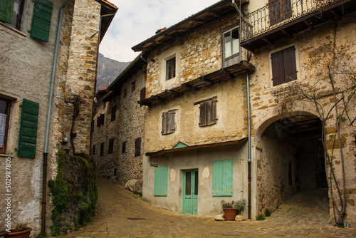 Fototapeta Naklejka Na Ścianę i Meble -  A residential street in Poffabro, an historic medieval village in the Val Colvera valley in Pordenone province, Friuli-Venezia Giulia, north east Italy
