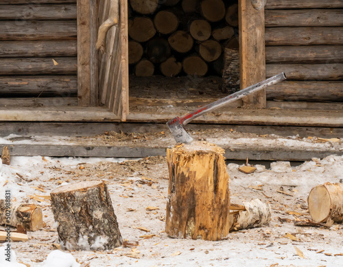 A Metal Axe Stuck in a Chopping Block