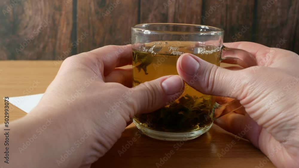 Tea with marijuana, cannabis with herbal decoction to treat pain and increase appetite. Hemp herbal tea, concept of marijuana use for medicinal purposes. Tea with marijuana, cannabis with herbal decoction to treat pain and increase appetite. Hemp herbal tea, concept of marijuana use for medicinal purposes.