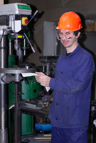 Machine operator working in factory