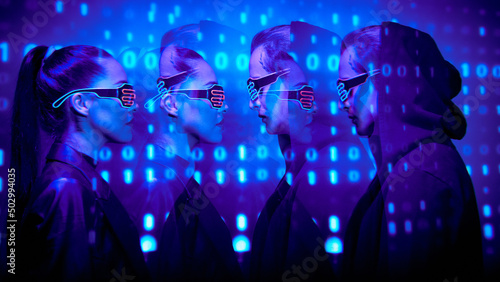 Fototapeta Naklejka Na Ścianę i Meble -  Side view of serious affectionate young couple in neon goggles standing against cyber security background with binary code