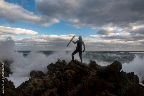 Fisherman facing sea storm before diving