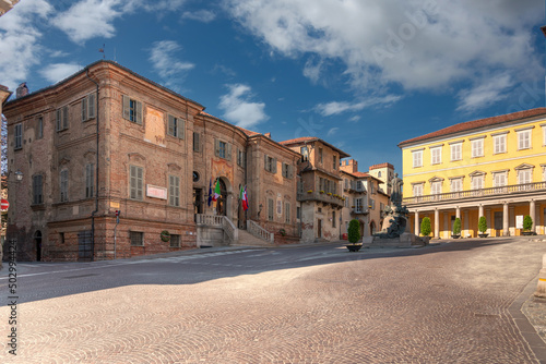Bra; Cuneo; Piedmont; Italy - May 01; 2022: Town hall building of Bra (project by Bernardo Vittone 1897) in piazza Caduti per Liberta with ancient medieval buildings in the background