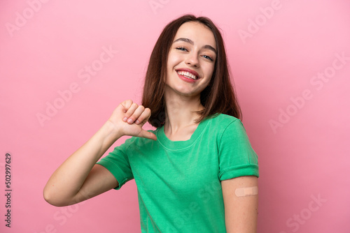 Young Ukrainian woman wearing a band aids proud and self-satisfied