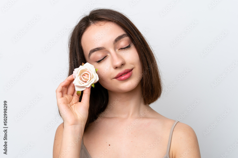 Young Ukrainian woman isolated on white background holding flowers. Close up portrait Young Ukrainian woman isolated on white background holding flowers. Close up portrait