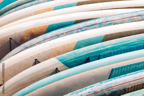Close-up of colorful paddle boards for rent. Fototapeta