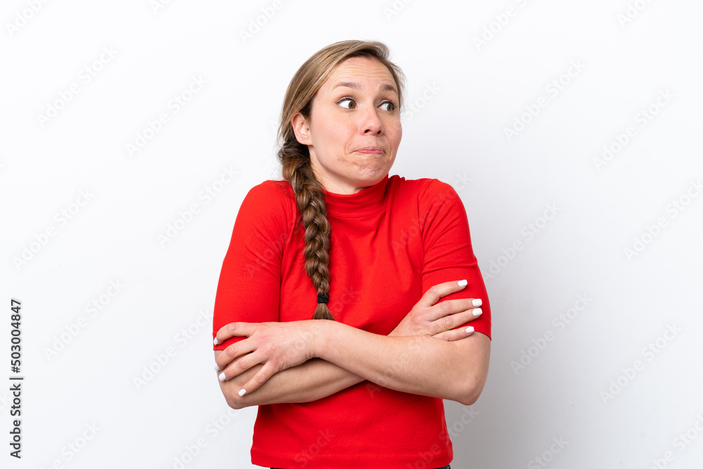 Young caucasian woman isolated on white background making doubts gesture while lifting the shoulders Young caucasian woman isolated on white background making doubts gesture while lifting the shoulders