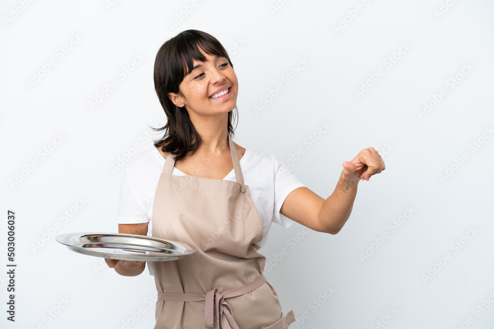 Young waitress with tray isolated on white background giving a thumbs up gesture Young waitress with tray isolated on white background giving a thumbs up gesture