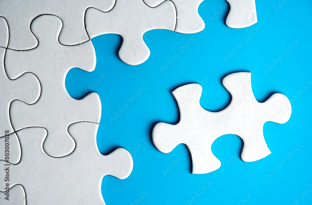 White jigsaw puzzle form with blue background. White jigsaw puzzle form with blue background.