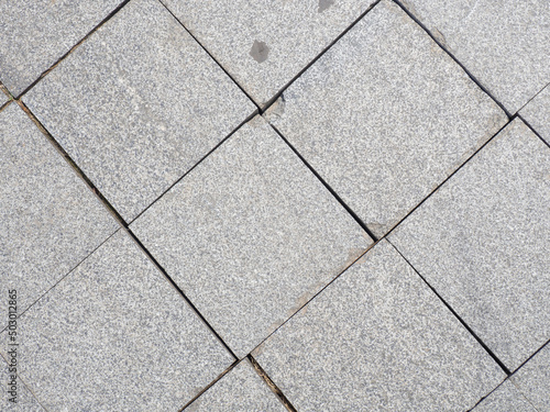 Drawing tiles on the pavement. Stone street surface. Masonry.