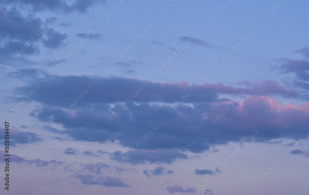 Evening blue sky with beautiful blue and pink clouds