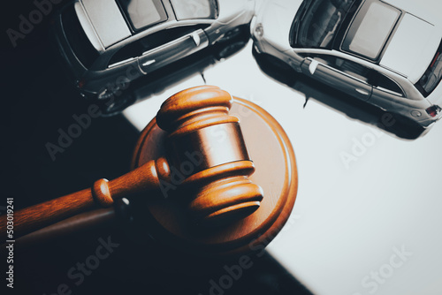 Model of car and gavel. Accident lawsuit or insurance, court case.