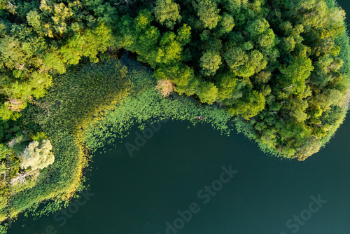 Aerial view of scenic Rubikiai lake, located near Anyksciai town, Lithuania. Landscape view from the above on summer sunset.