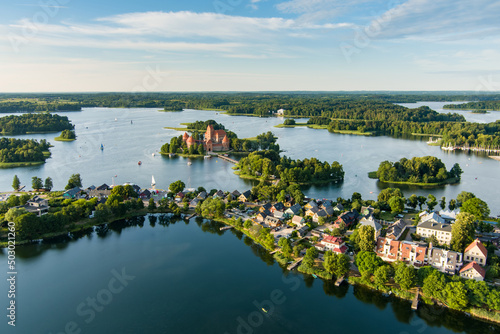 Aerial view of Trakai Island Castle and its surroundings, located in Trakai, Lithuania. Beautiful view from the above on summer sunset.