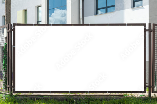 Принти на полотні Blank white advertising banner in front of the office building