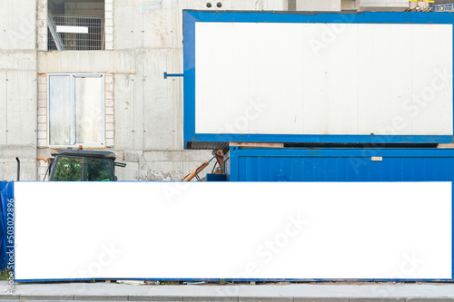 Blank white banner for advertisement mounted on the hoardin of construction site