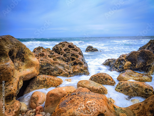 rocks on the gloomy beach photo