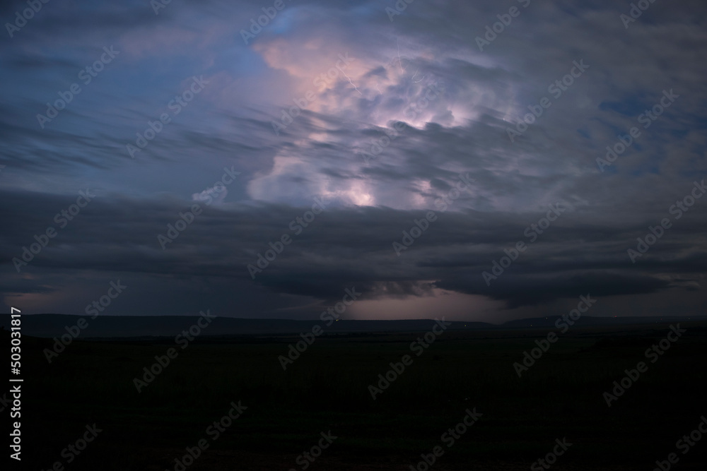 Fototapeta premium Thunderstorm over the Great Rift Valley in the Maasai Mara, Kenya.