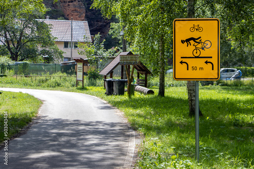 Road sign by the way with warning information for cyclists about the danger of falling