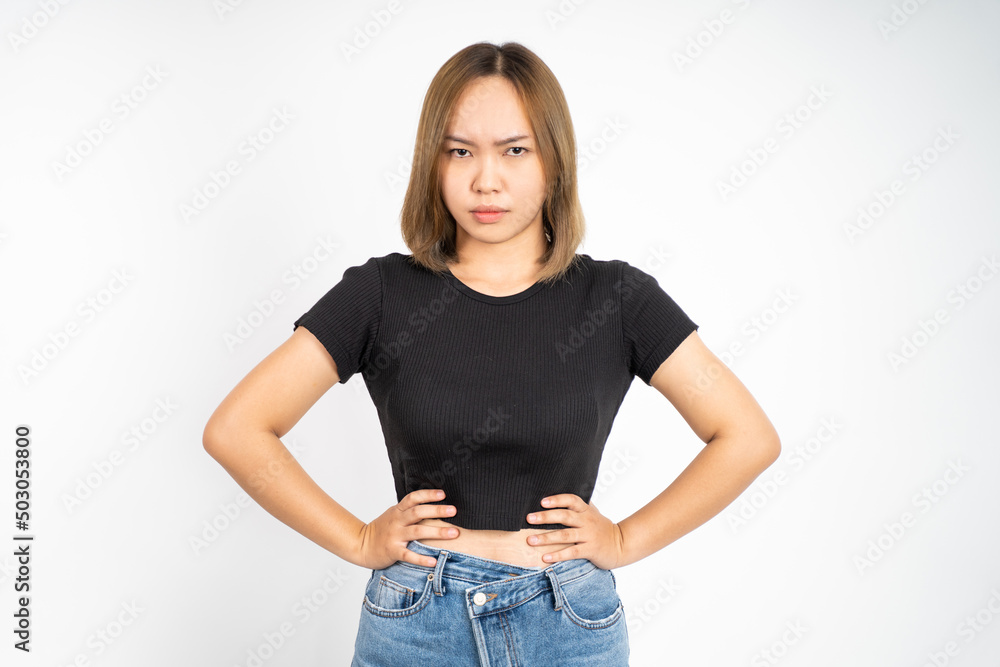 Obraz premium serious expression portrait of young asian woman over isolated background feeling uncertain