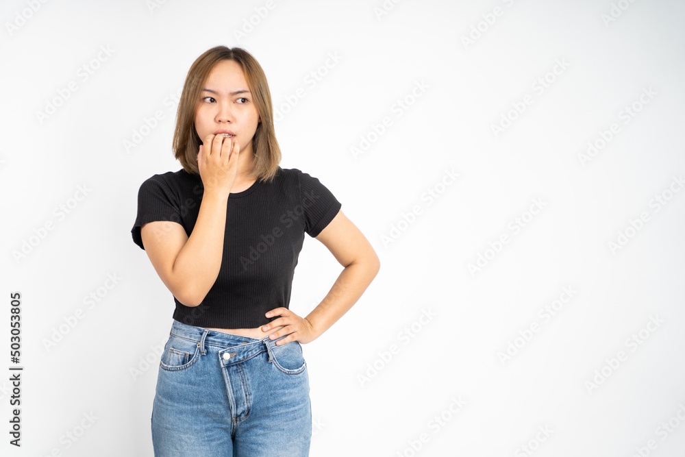 scared young woman with hand on her face. worried girl on isolated background scared young woman with hand on her face. worried girl on isolated background