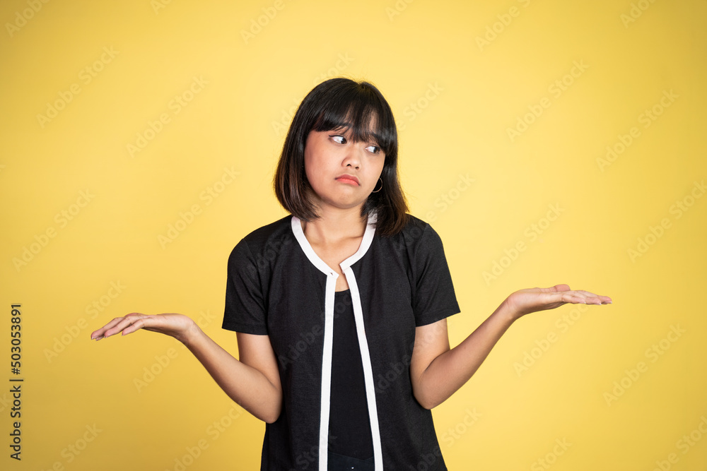 woman opening two palms does not know what to do on isolated background feeling uncertain woman opening two palms does not know what to do on isolated background feeling uncertain