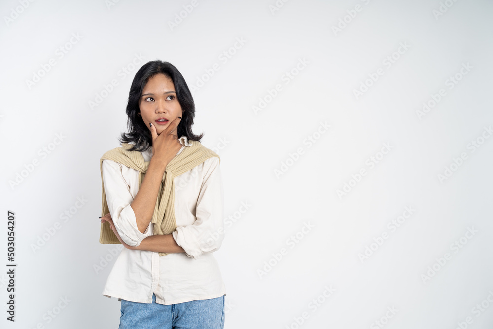 Young asian woman thinking gesture. beautiful woman on isolated background with thoughtful expression Young asian woman thinking gesture. beautiful woman on isolated background with thoughtful expression