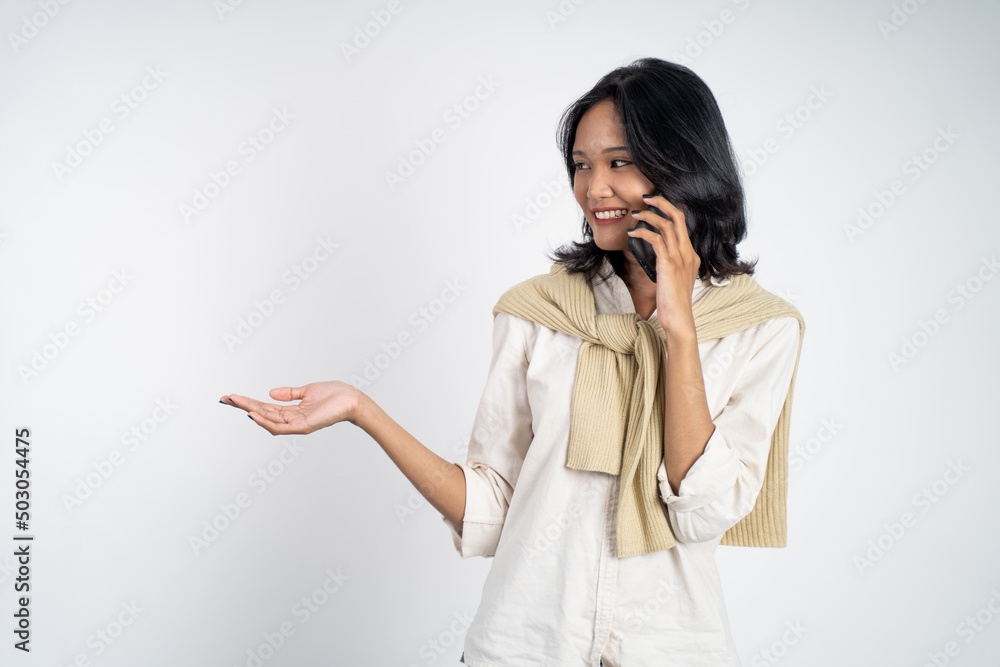 woman call on mobile phone with hand gesture presenting something on isolated background woman call on mobile phone with hand gesture presenting something on isolated background