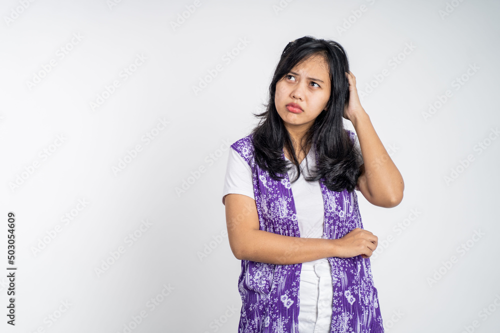 Young asian woman thinking gesture. beautiful woman on isolated background with thoughtful expression Young asian woman thinking gesture. beautiful woman on isolated background with thoughtful expression