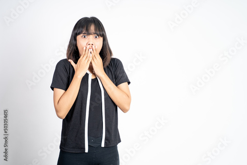 portrait of a asian woman covering her mouth with hands. concept of stop talking