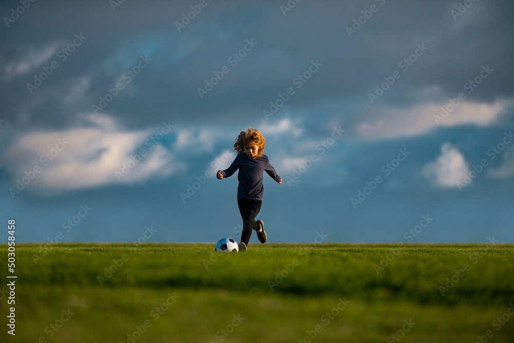 Kid playing soccer, happy child enjoying sports football game, kids activities, little soccer player. Active sporty kid soccer. Concept of children sport. Kid playing soccer, happy child enjoying sports football game, kids activities, little soccer player. Active sporty kid soccer. Concept of children sport.