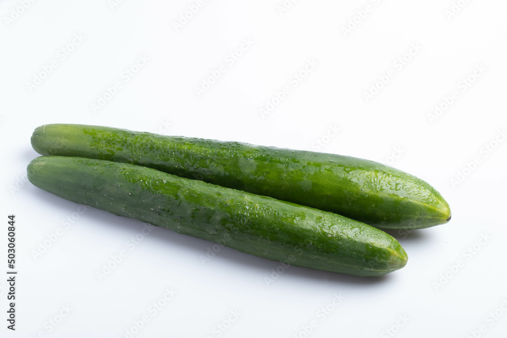 Two Japanese cucumbers on a white background Two Japanese cucumbers on a white background