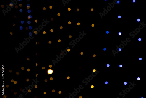 Black background with golden light effects. background with Blur bokeh effects. Abstract background texture