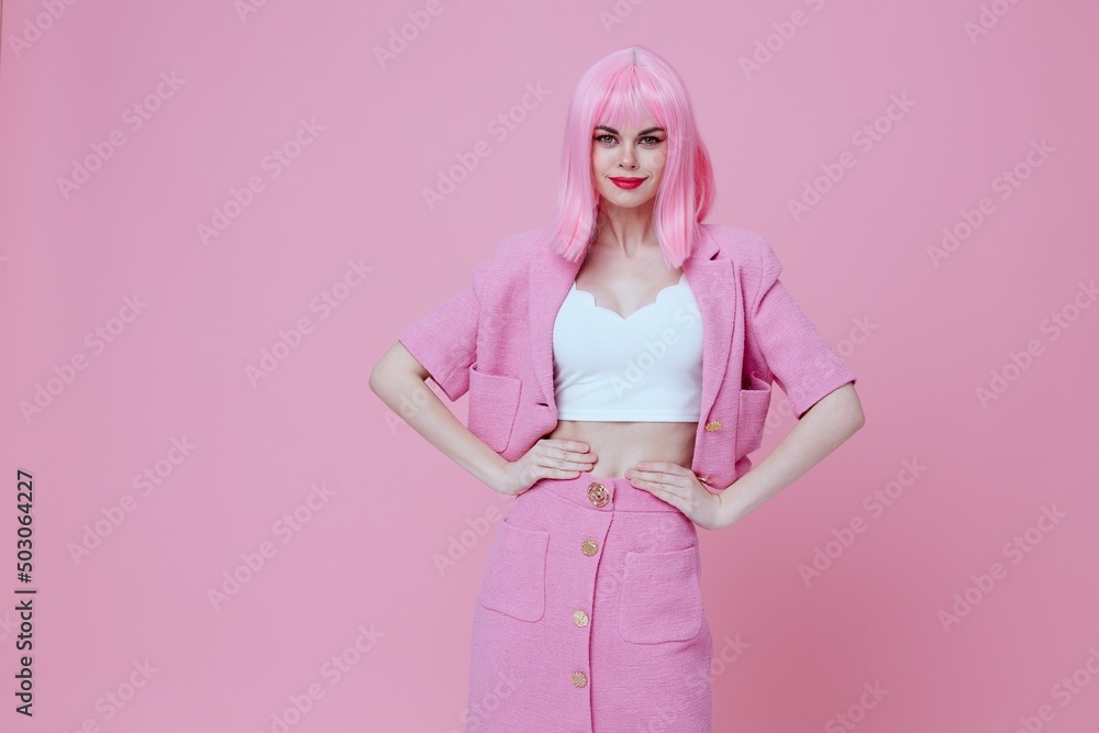 Beautiful fashionable girl gesturing with hands pink jacket lifestyle glamor color background unaltered Beautiful fashionable girl gesturing with hands pink jacket lifestyle glamor color background unaltered