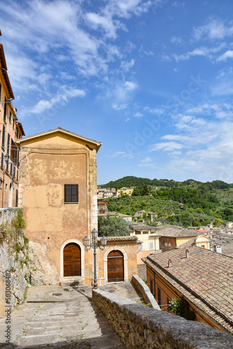 Konstfotografi Narrow alley between medieval stone buildings in Arpino, Province of Frosinone,