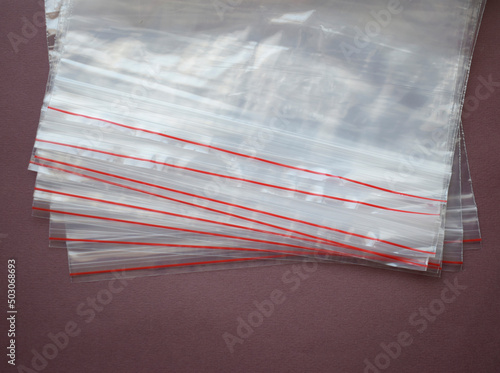 A set of plastic zip bags. Transparent plastic bags on a dark background.
