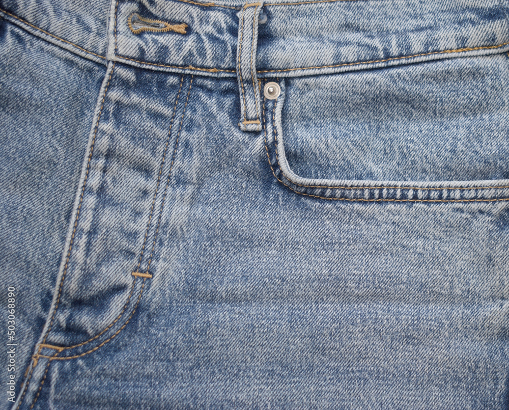 Texture of jeans, close-up. Blue jeans, denim background.