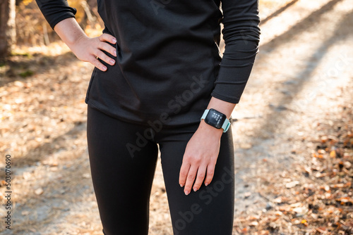 The figure of a girl with a smart watch with a fitness tracker, about health during sports