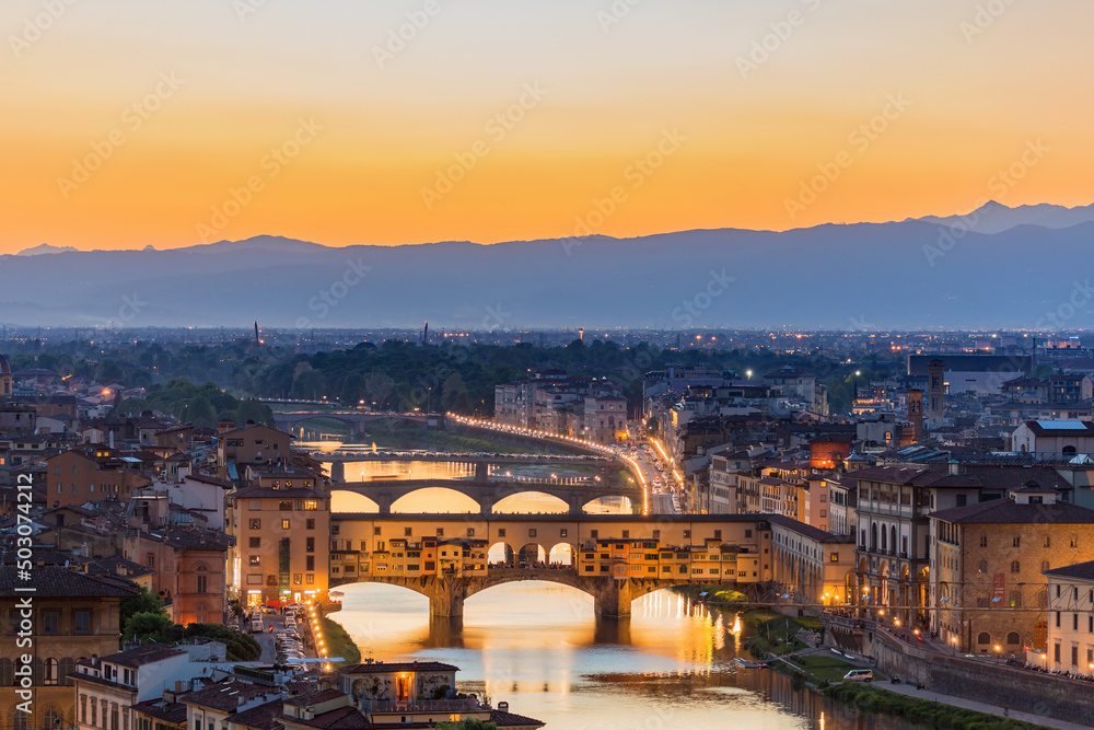 Ponte Vecchio bridge in silhouette in Florence at sunset