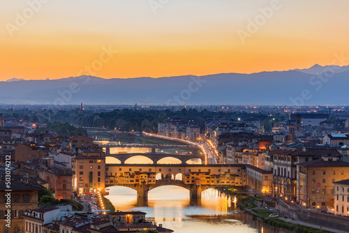 Ponte Vecchio bridge in silhouette in Florence at sunset