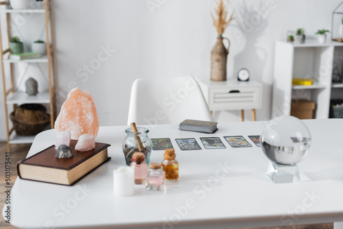 Принти на полотні KYIV, UKRAINE - FEBRUARY 23, 2022: Glass orb, magic crystals and tarot cards on table