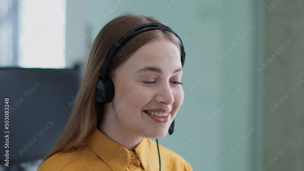 Customer support service. Young positive professional woman helpline operator wearing headset with mic talking to client Customer support service. Young positive professional woman helpline operator wearing headset with mic talking to client